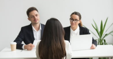 headhunters interviewing female job candidate